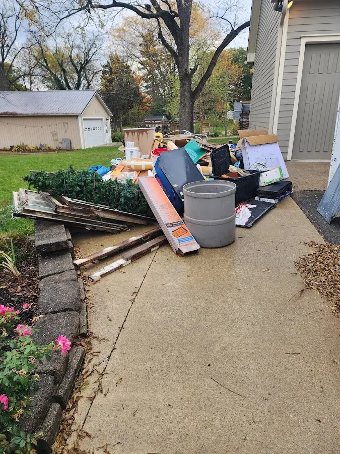 Dumpster being loaded with debris for Residential Dumpster Rental in Ruidoso